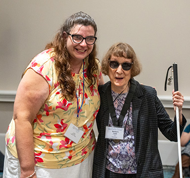 Cassie McKinney presents a Twig Award to Barbara Loos.